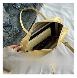 Top view of spacious yellow faux leather bag interior showing high storage capacity