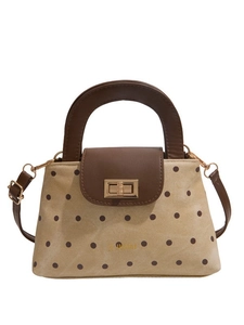 Beige polka dot tote bag with brown faux leather trim and golden metal clasp lock