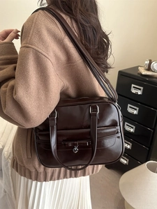 Minimalist large brown bowling bag with bow and heart charm for casual daily use