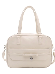 Minimalist white PU leather bowling bag with decorative bow and silver heart pendant