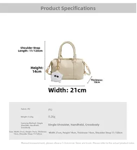 Detailed size specifications for cream PU leather handbag with plush ball pendant