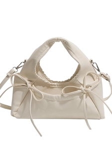 Elegant cream white half-moon crossbody bag with double bow detail and top handle