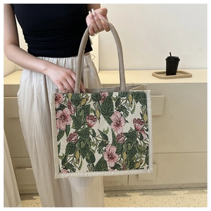 Detail of floral canvas tote bag with thick woven fabric and sturdy rope handles
