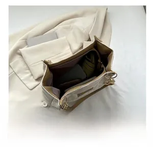 Interior view of beige quilted tote bag showing large capacity for daily essentials