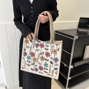 Large capacity canvas tote bag with floral print and woven handles for daily commute