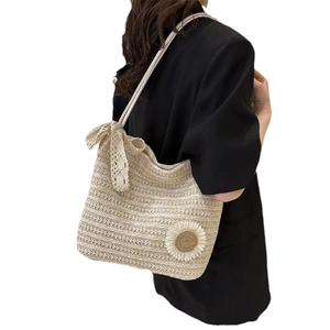 Beige woven straw tote bag with 3D daisy flower and lace bow detail for summer