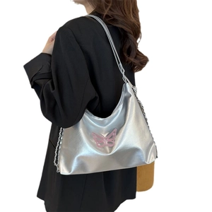 Silver metallic shoulder bag with pink butterfly embroidery and chain strap detail