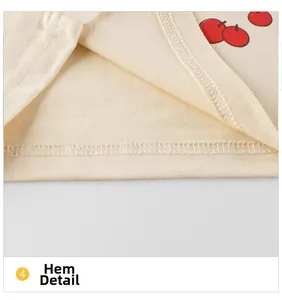 Vue détaillée de l'ourlet de t-shirt pour bébé avec imprimé cerise et couture double