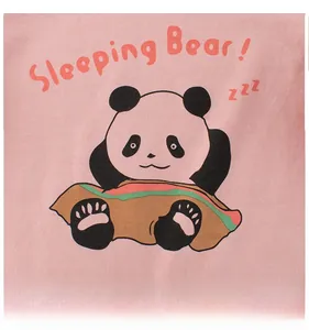 Close-up of pink cotton fabric featuring a cute cartoon sleeping panda with Sleeping Bear text