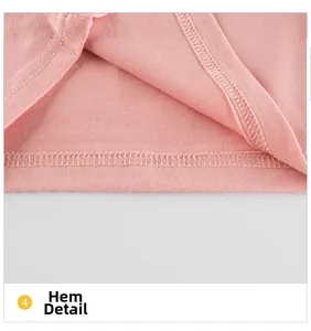 Ourlet détaillé d'un t-shirt en coton rose à manches longues pour filles avec double couture