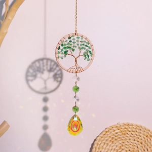 Detail of crystal suncatcher tree of life with colorful prism drops for car interior