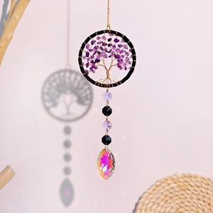 Macro detail of purple amethyst tree of life car charm with rainbow crystal teardrop