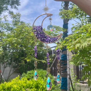 Golden moon sun catcher with amethyst stones and crystal prisms reflecting sunlight