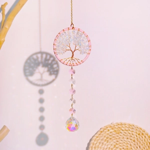 Detailed view of Tree of Life suncatcher with pink frame and faceted crystal ball prism
