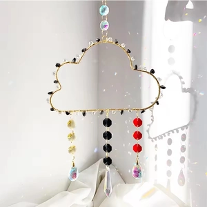 Macro detail of cloud crystal suncatcher showing gold wire and prism light refraction