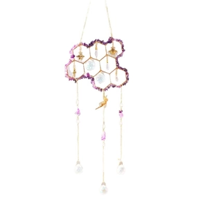 Golden honeycomb suncatcher with purple crystal stones and bee pendants on white background