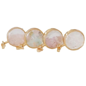 Set of four circular gold crystal perfume pendants with colorful gravel inlays