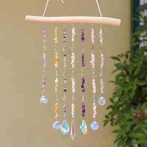 Handmade chakra crystal suncatcher with natural stones, wooden rod, and prisms for wall decor