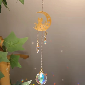Detailed view of rainbow light reflections from moon cat crystal suncatcher