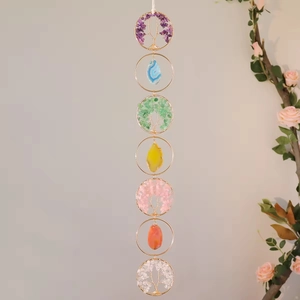 Detail of bohemian life tree wall hanging with Seven Chakra crystals and agate slices