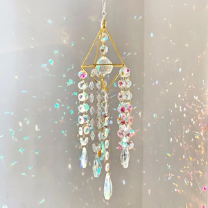 Golden geometric crystal suncatcher with teardrop pendant and rainbow light reflections