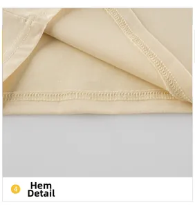Détail de l'ourlet aux coutures soignées sur le haut en tricot de coton pour fille
