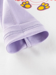 Close-up of baby long-sleeve cotton T-shirt showing purple cuff and double-needle stitching
