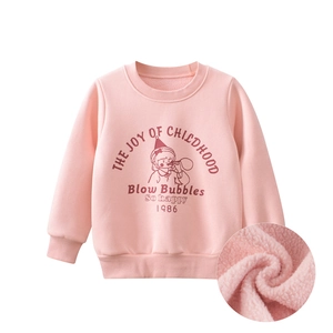 Detailed macro view of the thick warm fleece lining on a pink girls' sweatshirt