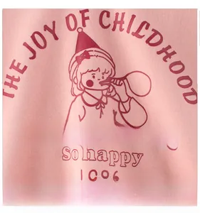 Detail of cartoon girl graphic and vintage typography on pink cotton girl sweatshirt