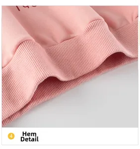 Detailed close-up of the ribbed hem on a pink girls' sweatshirt with fine knit texture