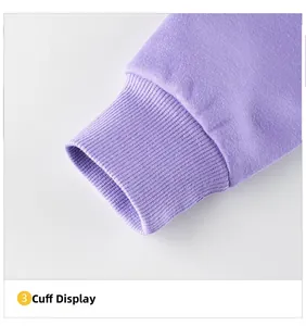 Close-up of purple ribbed cuffs on kids sweatshirt showing elastic fabric texture