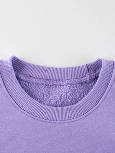Purple girls' crewneck sweatshirt with warm fleece lining and ribbed neckline details