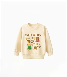 Detail of cream long-sleeved kids sweatshirt with cartoon bear and A BETTER LIFE print