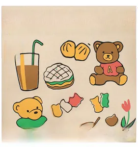 Close-up of A BETTER LIFE cartoon bear and food print on beige fleece sweatshirt