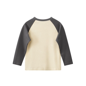 Close-up of kids raglan long sleeve t-shirt with charcoal grey sleeves and cream body