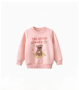 Close-up of pink long-sleeved sweatshirt featuring a cool cartoon bear and summer graphics
