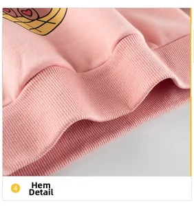 Close-up of pink sweatshirt hem featuring high-elastic ribbed knit and bear print