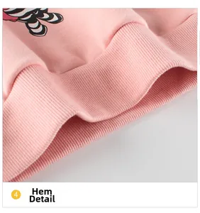 Detailed close-up of pink knit sweatshirt ribbed hem with soft elastic texture