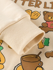 Kids cream long sleeve sweatshirt with cartoon bear print and ribbed elastic cuffs