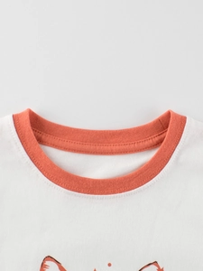 Kids short sleeve white T-shirt with orange ribbed crew neck and cartoon print details