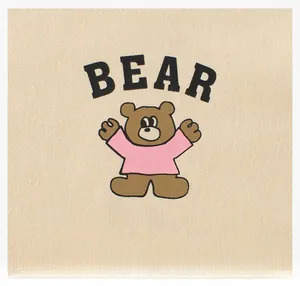 Close-up of cute cartoon bear print and BEAR text on beige knit cotton kids T-shirt