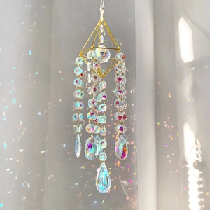 Detail of crystal suncatcher with golden geometric frame and rainbow AB beads