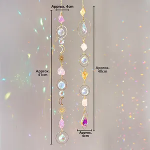 Detail of suncatchers with natural raw amethyst crystals and gold hanging accents