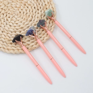 Pink ballpoint pens with natural raw crystals on top and rose gold metal finish