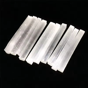Macro view of ten translucent white selenite crystal wands with fibrous texture
