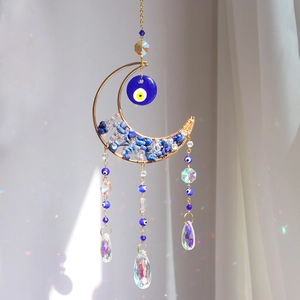 Bohemian moon suncatcher with blue evil eye beads and iridescent crystal prism pendants