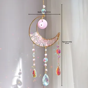 Detail of moon suncatcher with pink evil eye and crystals, dimensions 8.5cm by 25cm