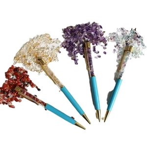 Blue crystal gravel ballpoint pens with gold accents and colorful gemstone fillings