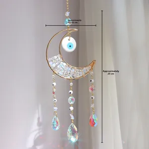 Detailed view of moon crystal suncatcher with evil eye charm and dimensions of 8.5x25cm