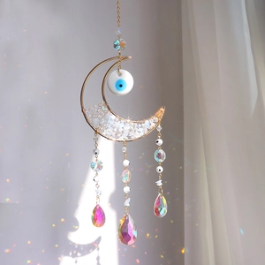 Moon shaped suncatcher with crystal stones, evil eye bead and prismatic rainbow pendants